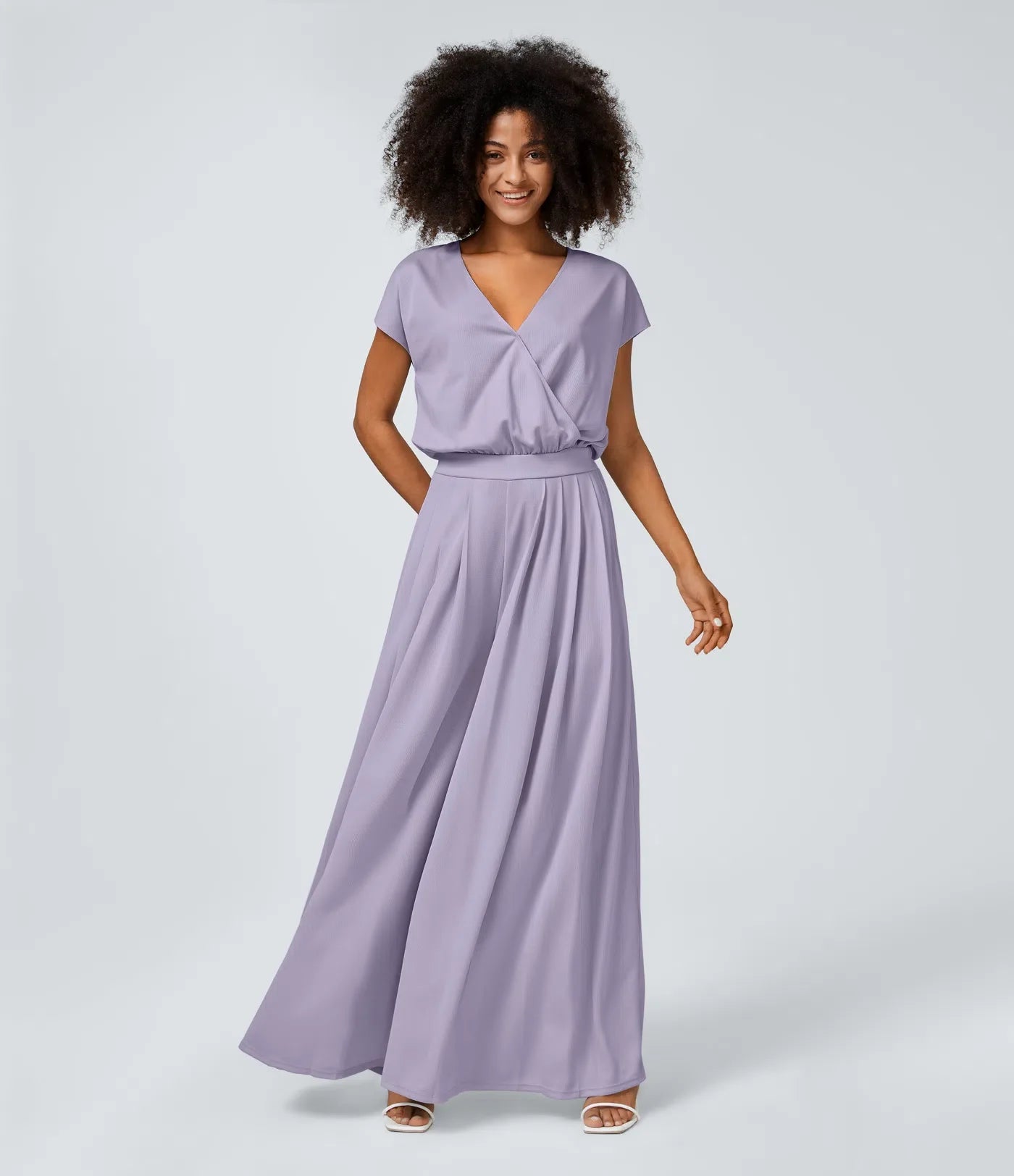 Jumpsuit™ - Tuta con scollatura a V, maniche corte, tasche laterali a pieghe e gamba larga, motivo a onde fluide.