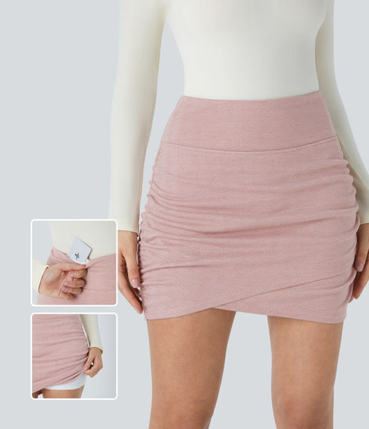 Minigonna 2 in 1: aderente con vita alta, tasche posteriori e motivo a spina di pesce