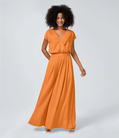 Jumpsuit™ - Tuta con scollatura a V, maniche corte, tasche laterali a pieghe e gamba larga, motivo a onde fluide.