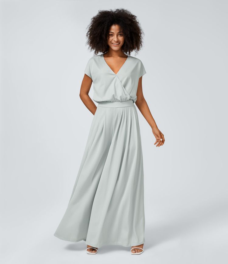 Jumpsuit™ - Tuta con scollatura a V, maniche corte, tasche laterali a pieghe e gamba larga, motivo a onde fluide.