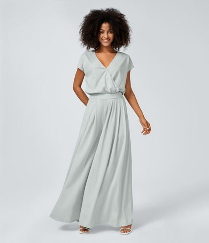 Jumpsuit™ - Tuta con scollatura a V, maniche corte, tasche laterali a pieghe e gamba larga, motivo a onde fluide.